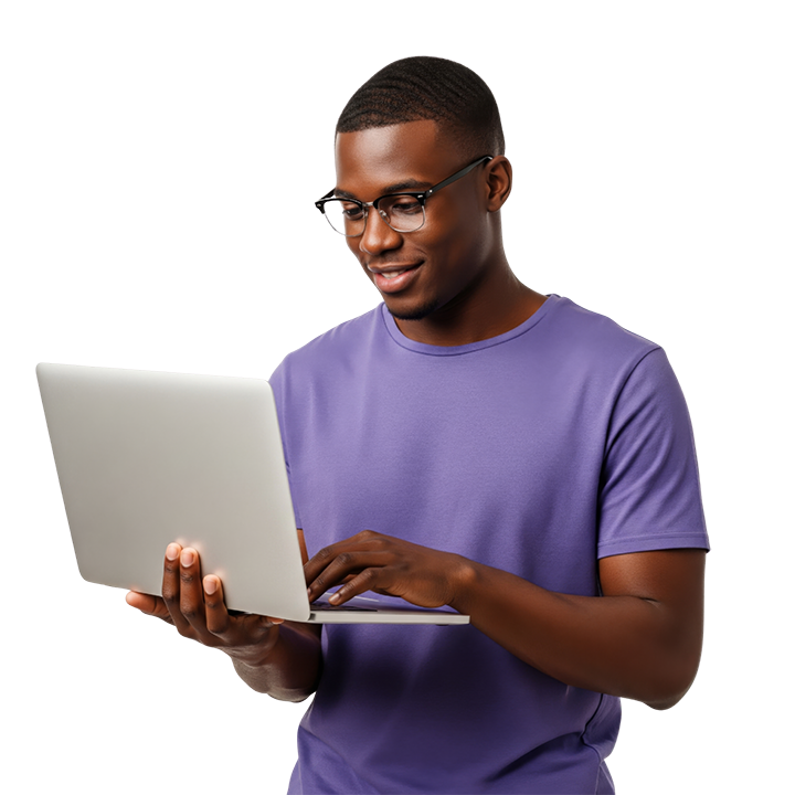 smiling black male with glasses looking at laptop computer