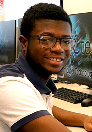 smiling black male computer student