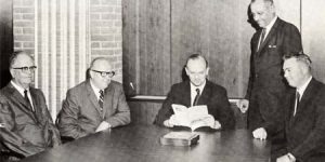 photo of first area commissioners at a board room table