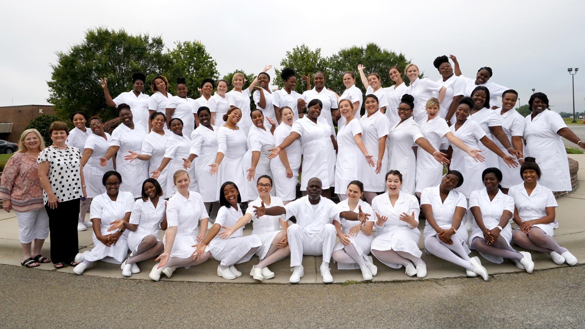 nursing graduates in uniforms