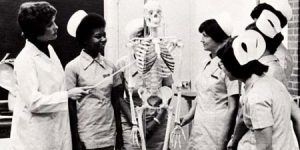 Nursing students with a skeleton model in the 1980s