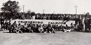 Group of students around campus sign in the 1970s