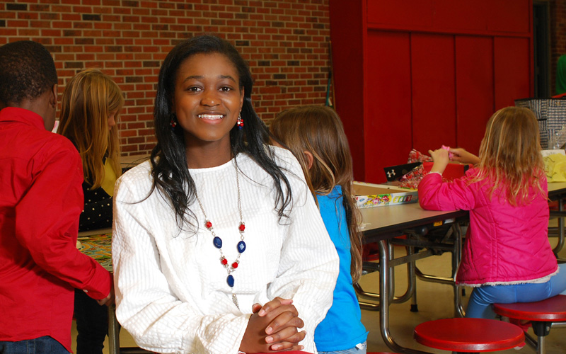 black female elementary teacher in class
