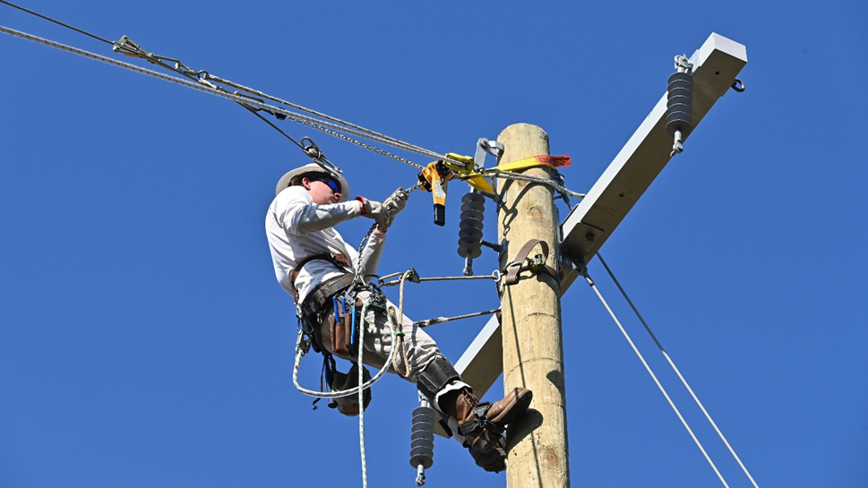Nathan Cook demonstrates his skills for prospective employers during the college’s first electrical lineman showcase.
